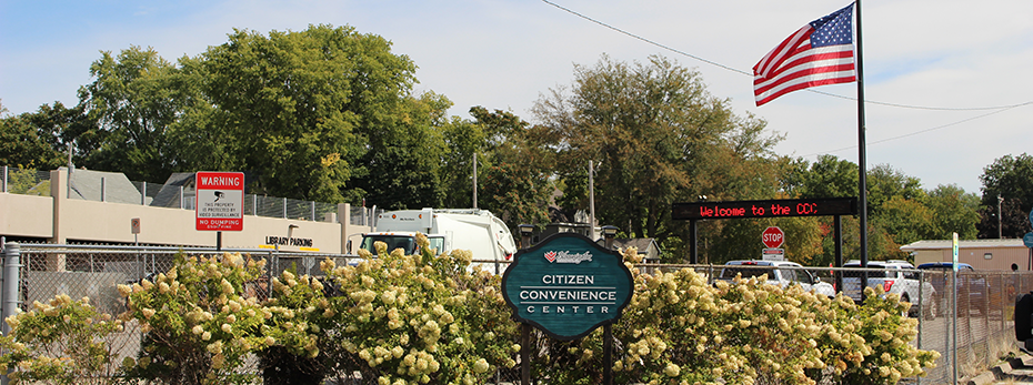 A solid waste drop off center with a sign that says 